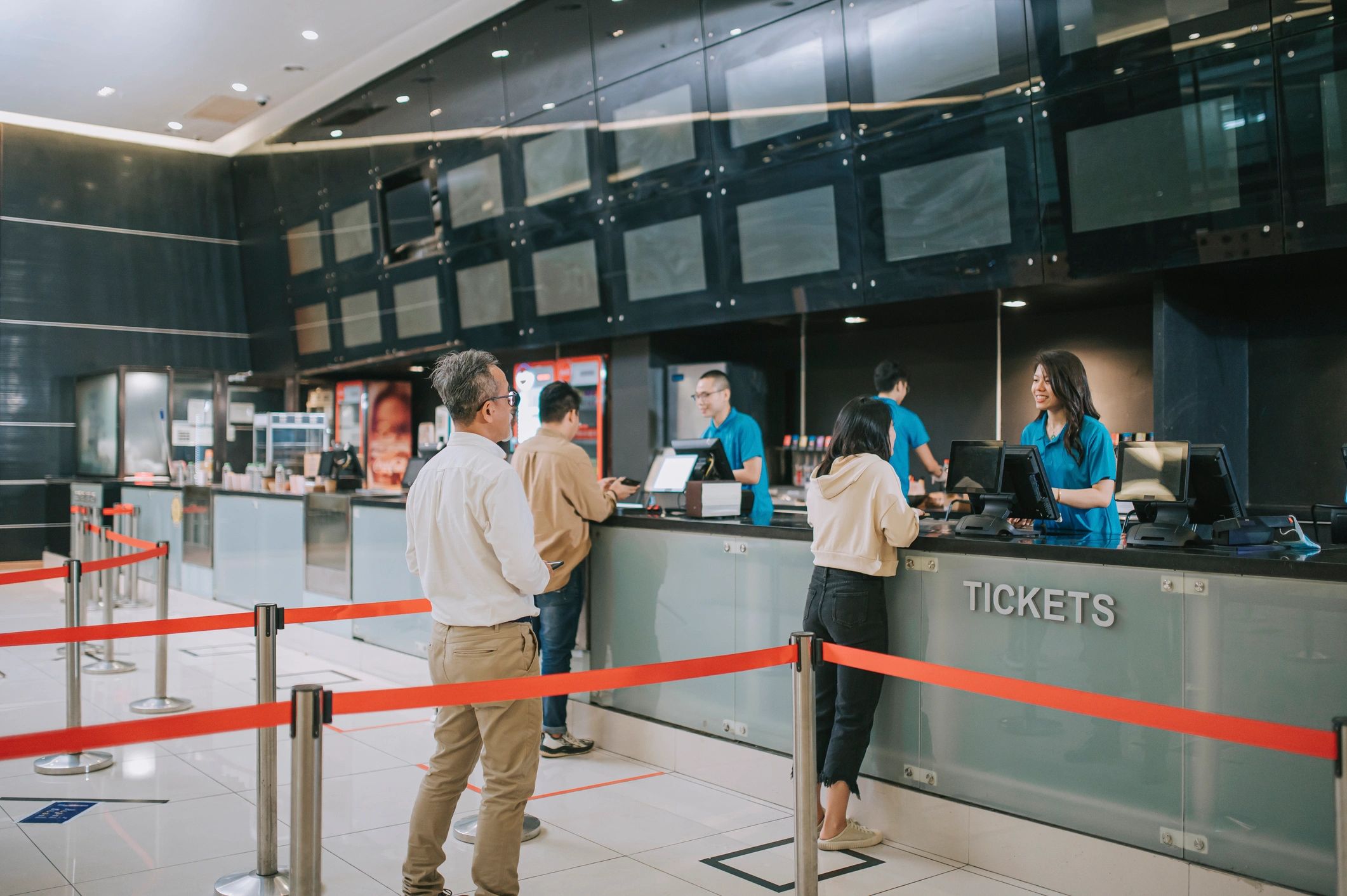 People lining up at a ticket counter