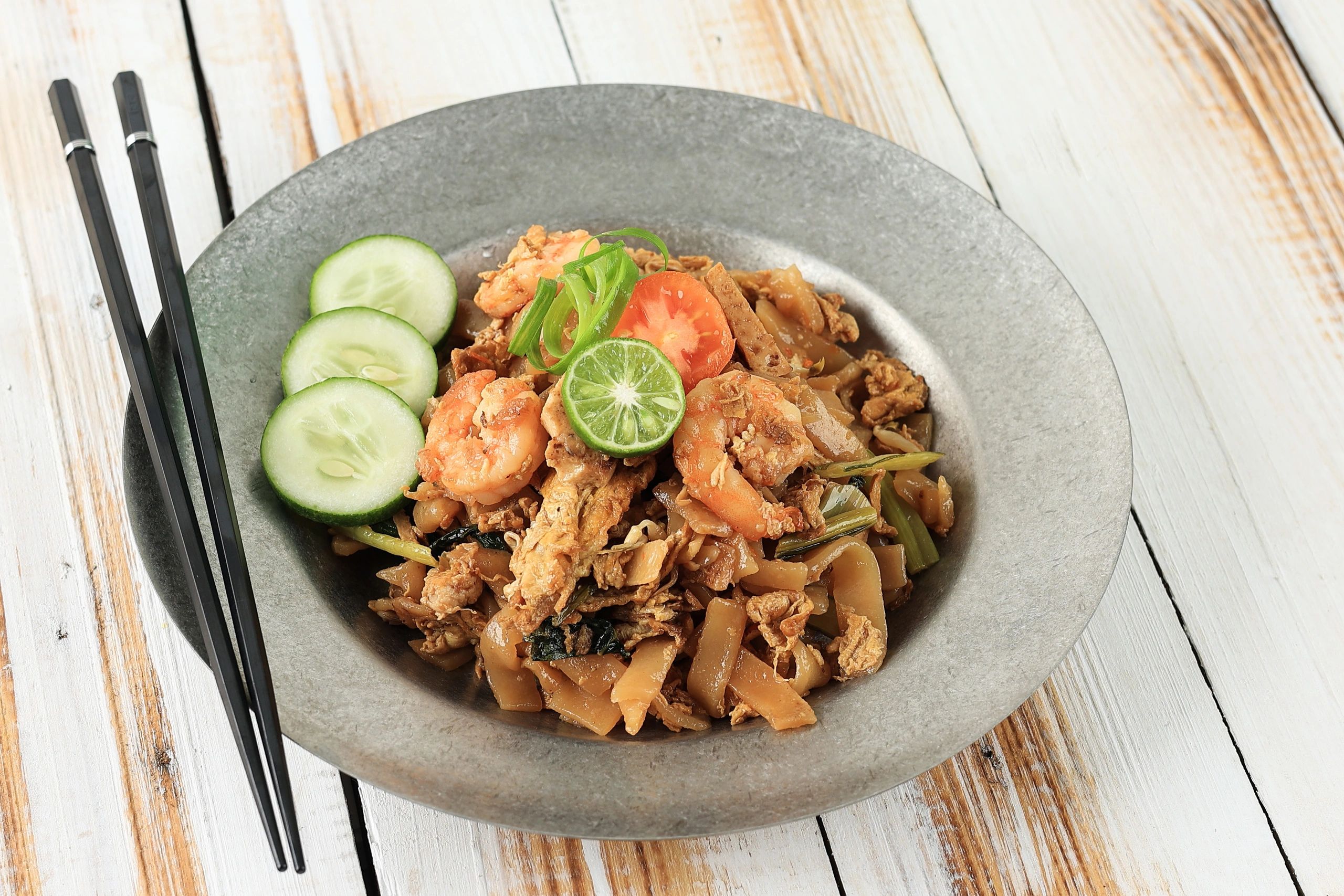 Stir-fried flat rice noodles (char kway teow) close-up