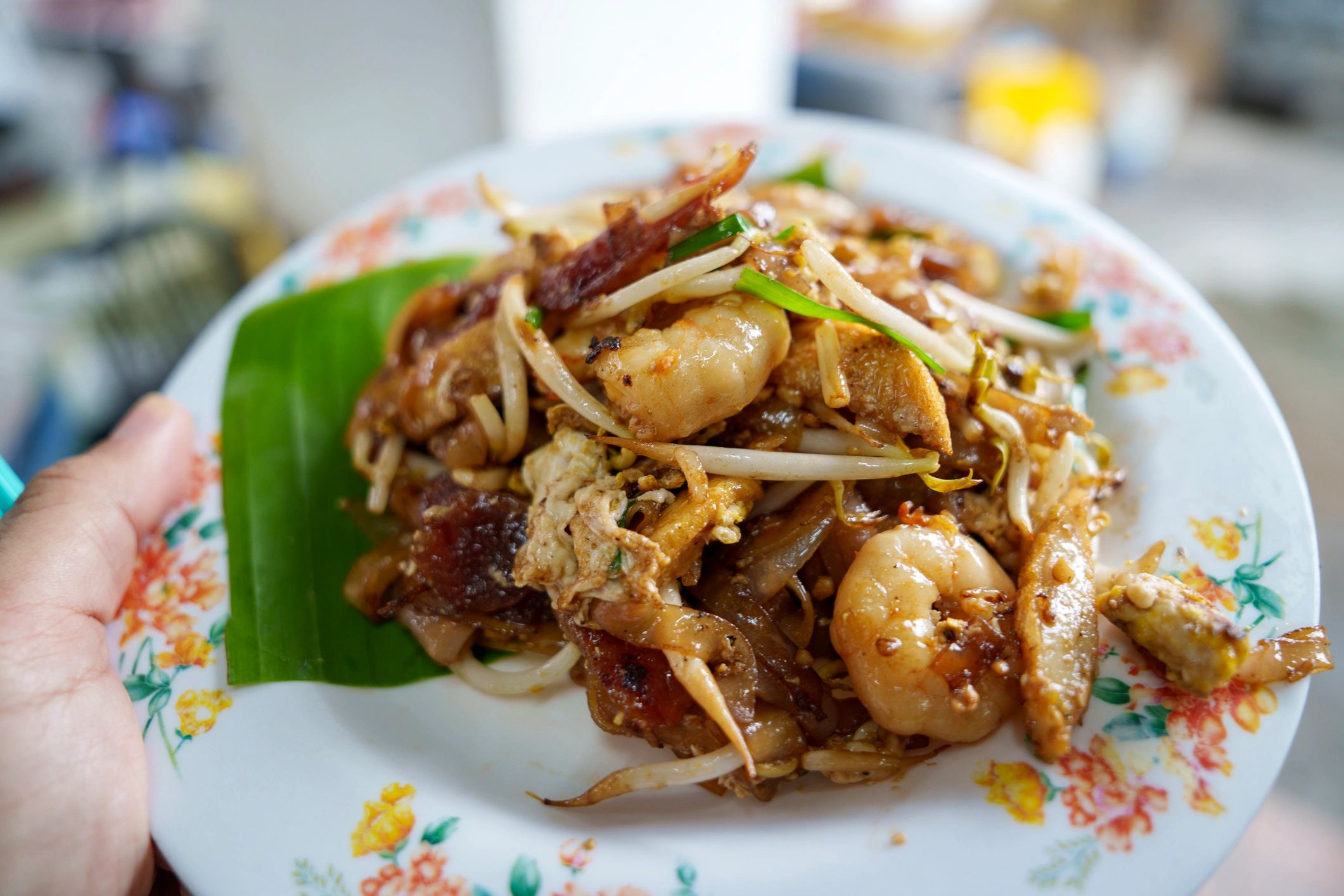 Plate of char kway teow with prawns and bean sprouts